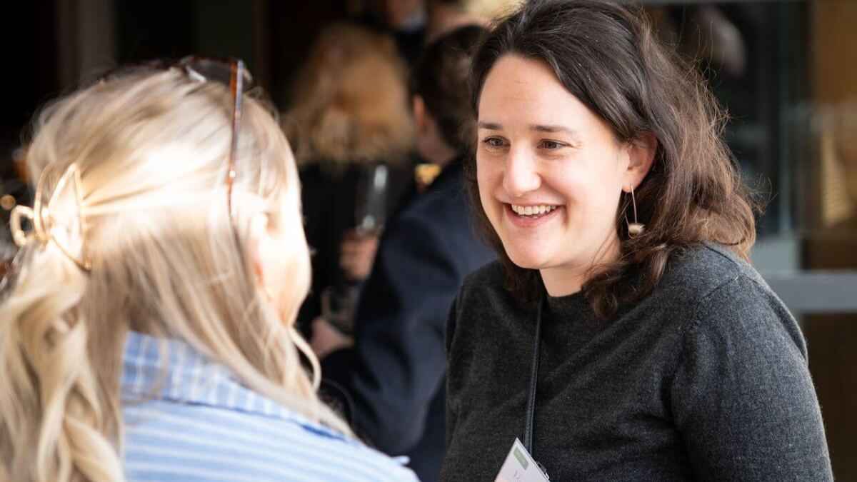 CoCreate Head of Programmes, Miriam Gosling Gage, having a conversation with someone at an event