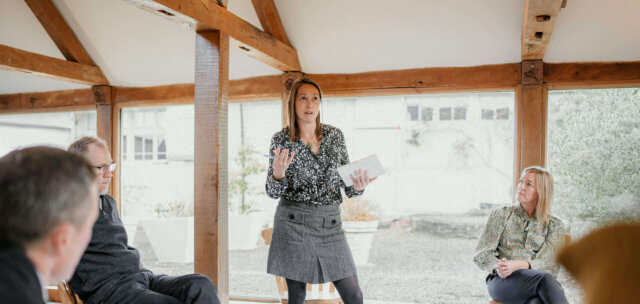 CoCreate Facilitator and Coach Caroline Evanson speaking to a group